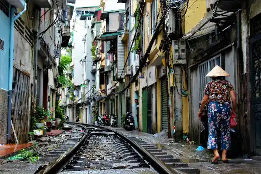 Lady walking on Railway line in Hanoi Hanoi railway line